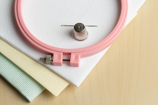 close-up pastel embroidery hoop with threads